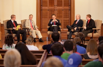 Howard Dean and Karl Rove participating in a student forum